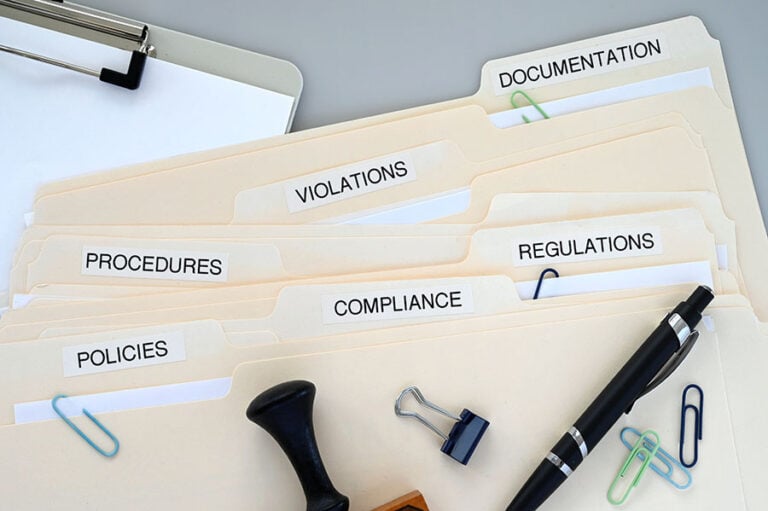 A collection of files marked compliance, regulations, violations, policies and procedures