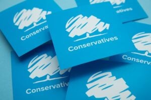 Conservative United Kingdom political party logo against a blue background