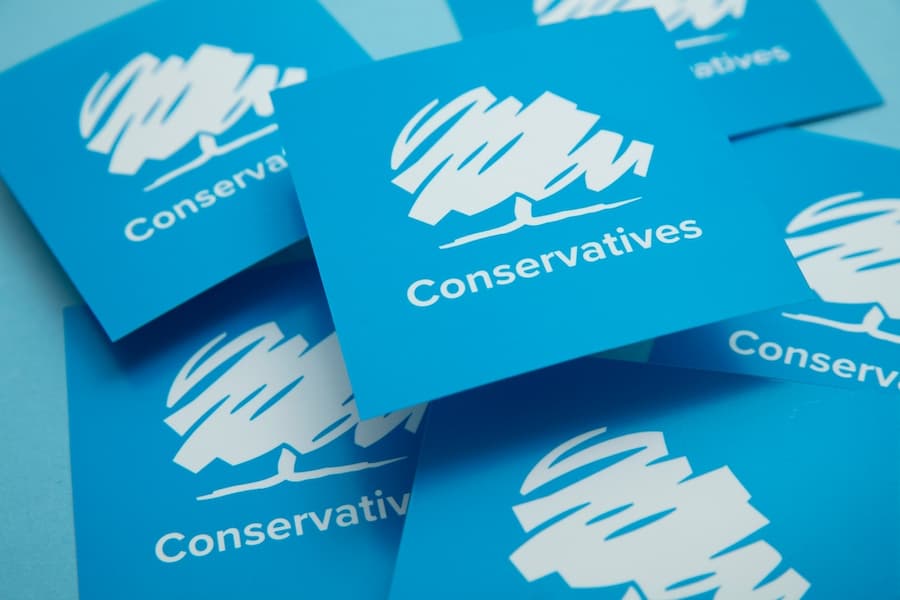 Conservative United Kingdom political party logo against a blue background